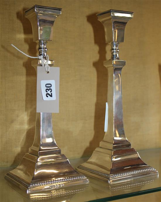 2 silver candlesticks